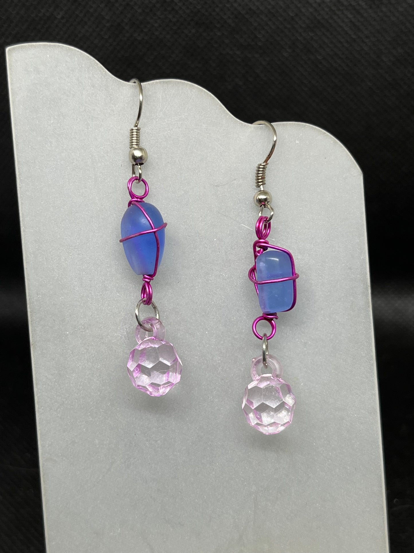 Wire wrapped blue glass with pink acrylic charm E840