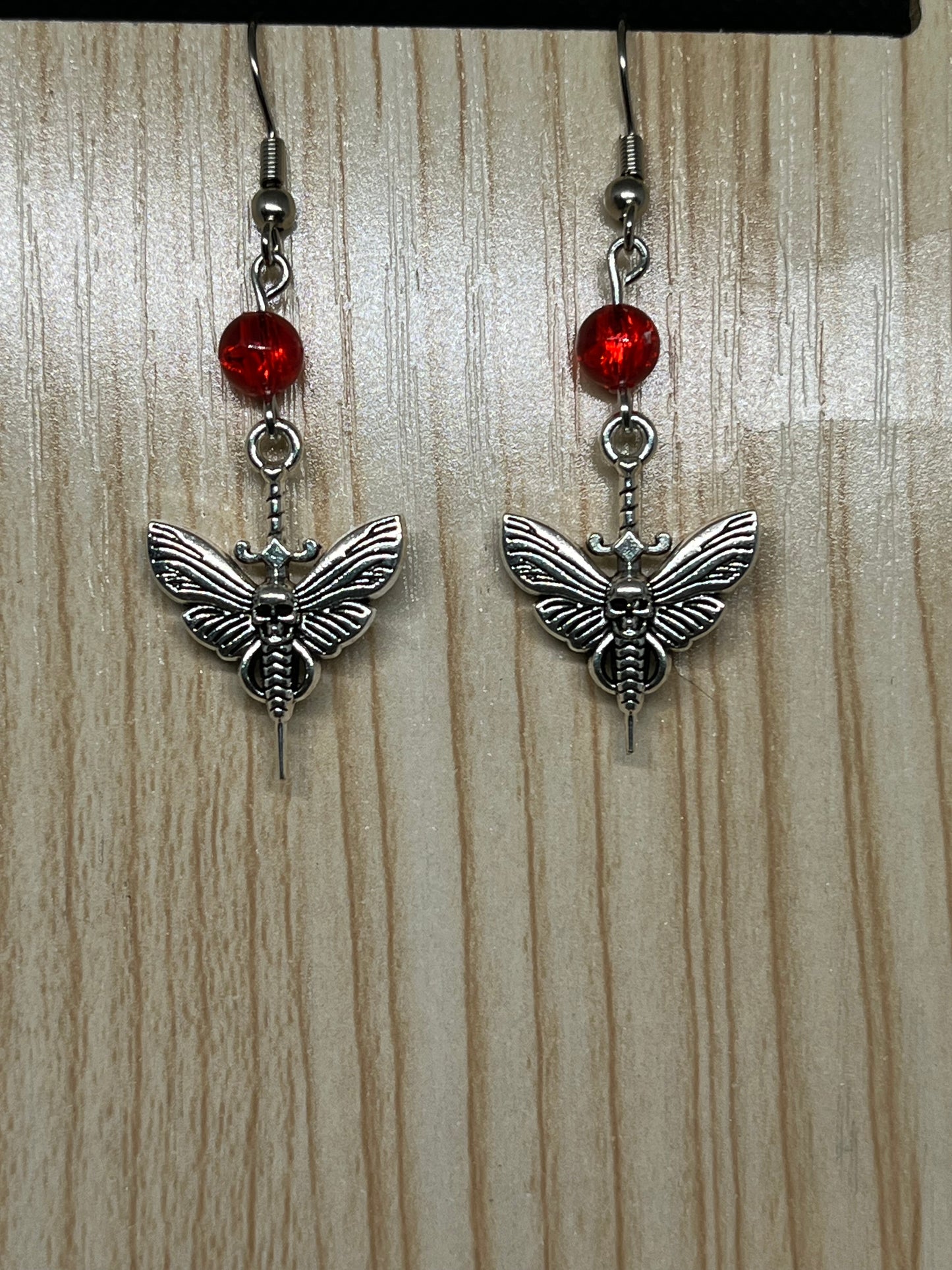 Sword with creepy moth earrings H174