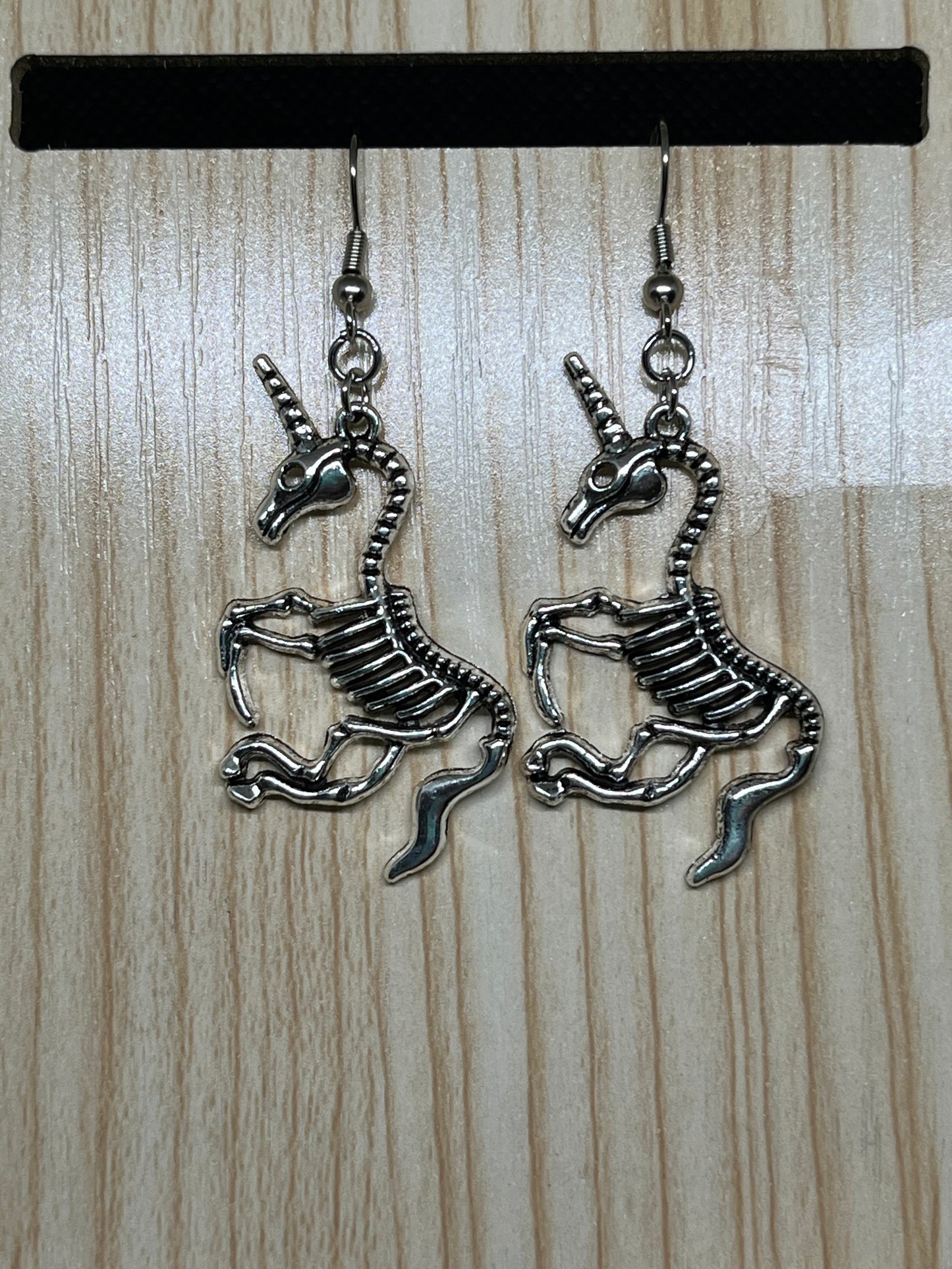 Unicorn skeleton earrings H175